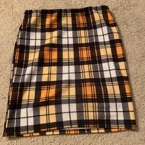 Yellow/black/white plaid mini skirt. clueless esque